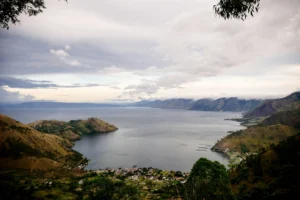 Explore Lake Toba in North Sumatra: a stunning tropical lake surrounded by mountains and forest
