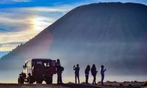 4WD jeep used as transportation at Mount Bromo driving across the Sea of Sand with Mount Batok in the background