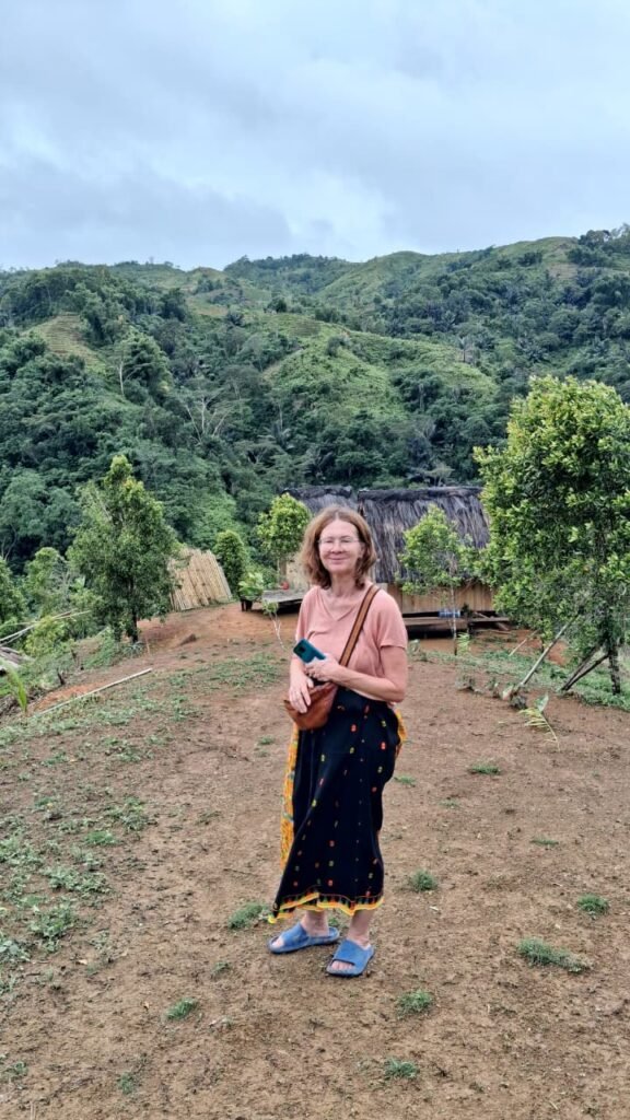 Slow travel in Sumba featuring quiet savannah landscapes, traditional villages, serene beaches, and travelers embracing a mindful, unhurried journey.