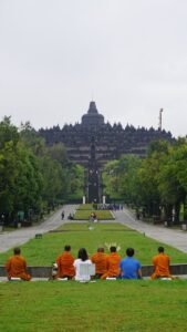 Visitors entering Borobudur Temple at sunrise with special access tickets in Yogyakarta, Indonesia