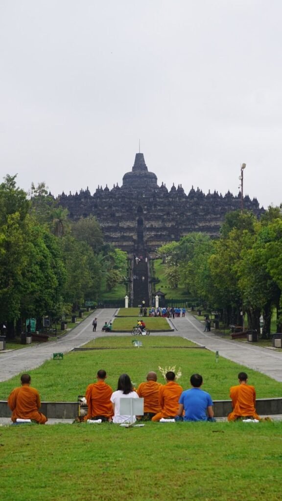 Visitors entering Borobudur Temple at sunrise with special access tickets in Yogyakarta, Indonesia