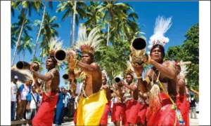 Traditional Papuan village life in Raja Ampat with wooden houses, local community, and tropical island surroundings