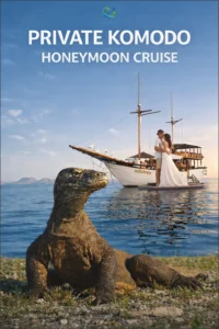 Private honeymoon yacht cruising in Komodo National Park at sunset with a couple enjoying a romantic moment on deck